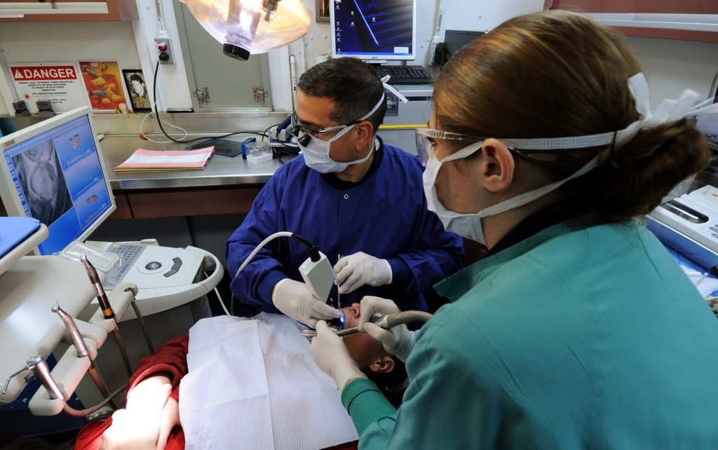 Dental hygienist with patient
